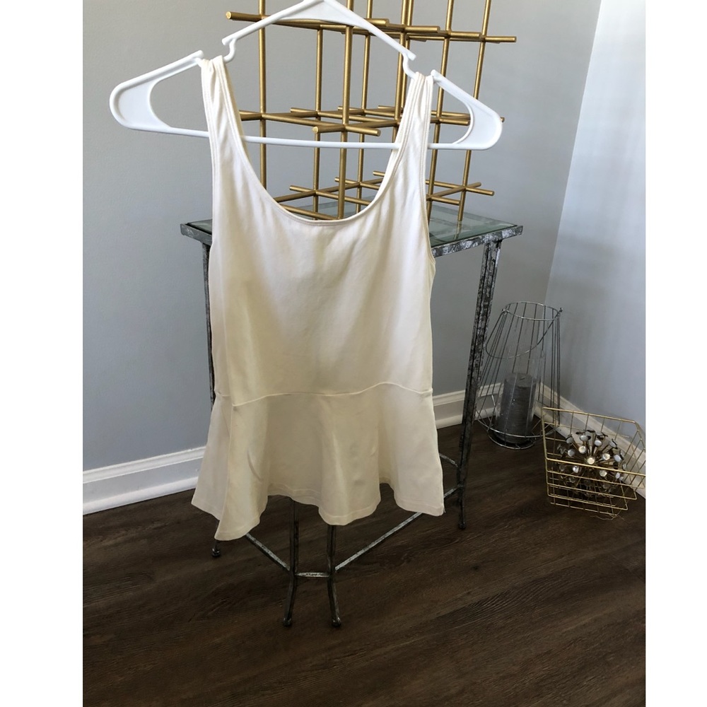 Cream peplum top.